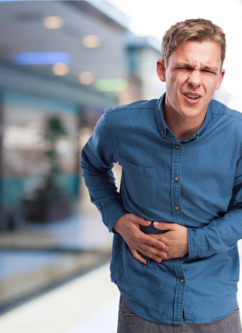 angry young-man suffering a stomachache